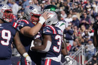 New England Patriots running back Damien Harris (37) is congratulated by center David Andrews after his touchdown during the first half of an NFL football game against the New York Jets, Sunday, Oct. 24, 2021, in Foxborough, Mass. (AP Photo/Steven Senne)