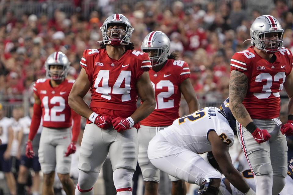 Sep 17, 2022; Columbus, Ohio, USA; Ohio State Buckeyes defensive end J.T. Tuimoloau (44) celebrates a tackle during the first half of the NCAA Division I football game against the Toledo Rockets at Ohio Stadium. Mandatory Credit: Adam Cairns-The Columbus Dispatch