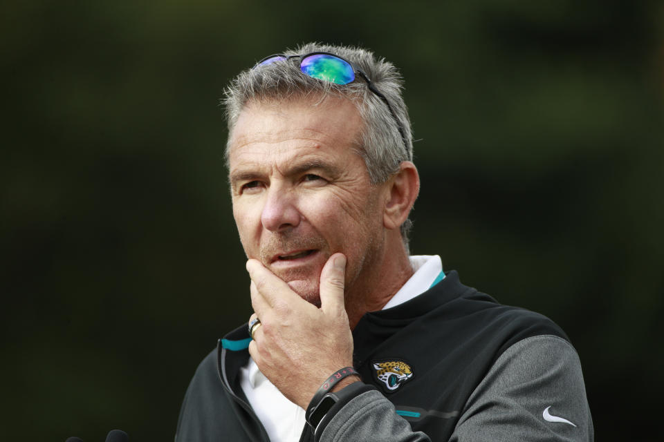 Jacksonville Jaguars head coach Urban Meyer listens to a question during a practice and media availability by the Jacksonville Jaguars at Chandlers Cross, England, Friday, Oct. 15, 2021. The Jaguars will plat the Miami Dolphins in London on Sunday. (AP Photo/Ian Walton)