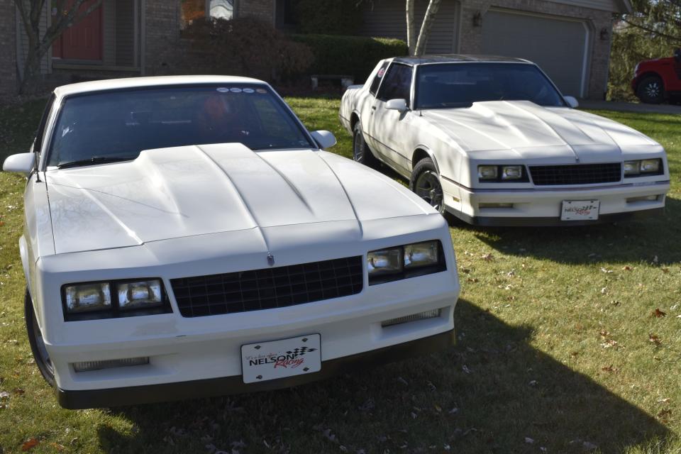 That's Carol Nelson's Monte Carlo on the left, and her husband Wayne's on the right, parked in their front yard.