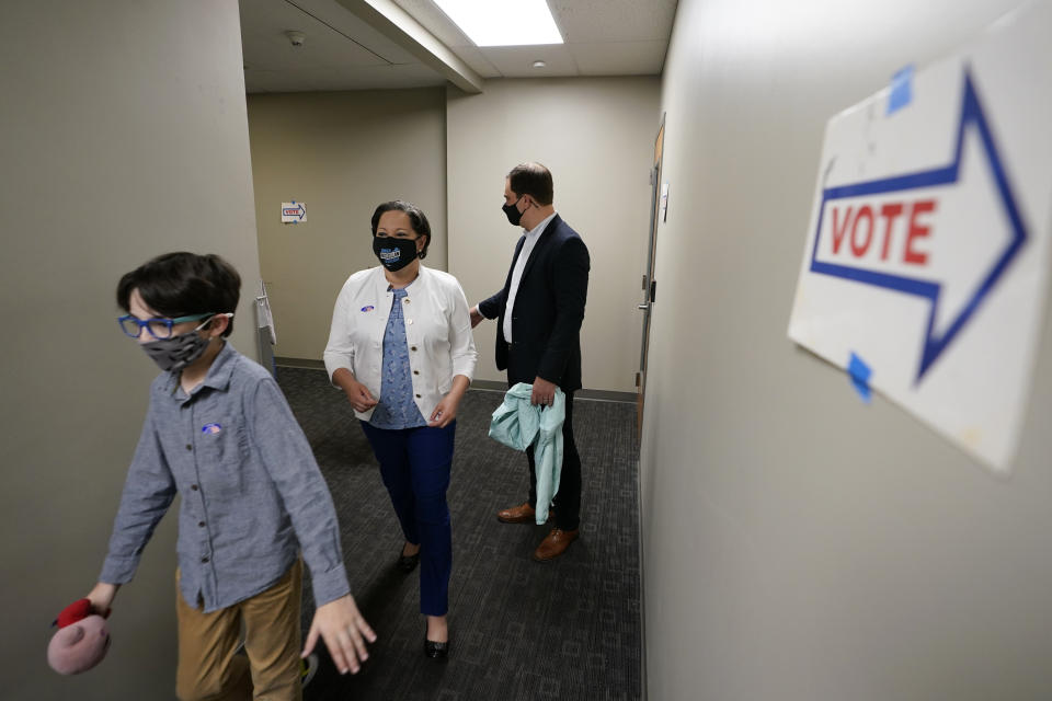 Democratic gubernatorial candidate, Virginia State Sen. Jennifer McClellan, center, leaves a voting location along with her son Jackson Mills, left, and husband, Dave Mills at an early voting location in Richmond, Va., Saturday, May 29, 2021. McClellan faces four other Democrats in the primary. (AP Photo/Steve Helber)