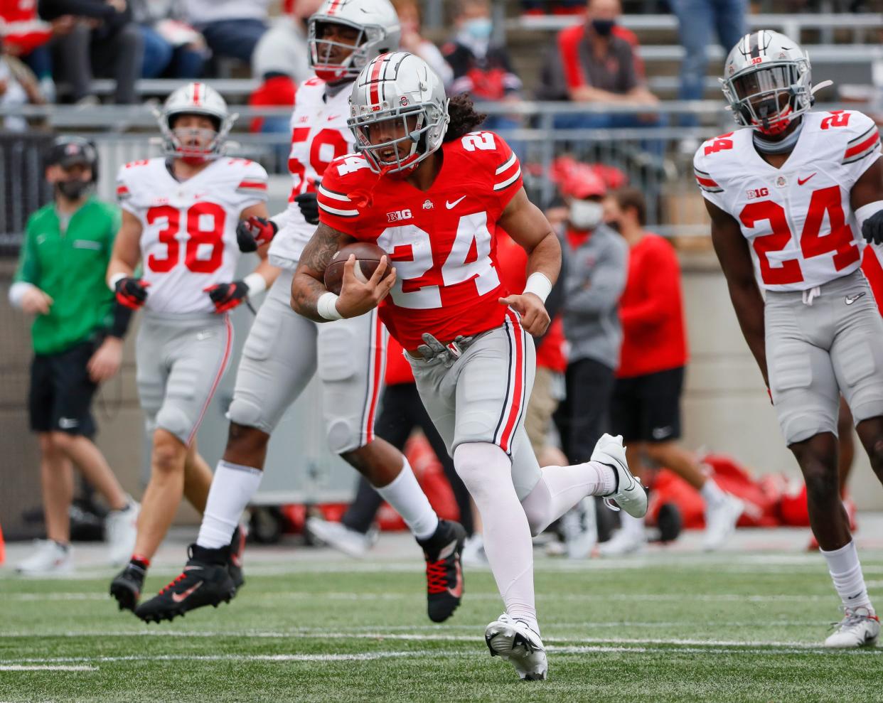 Team Buckeye running back Marcus Crowley (24) runs during the Ohio State Buckeyes football spring game at Ohio Stadium in Columbus on Saturday, April 17, 2021. 