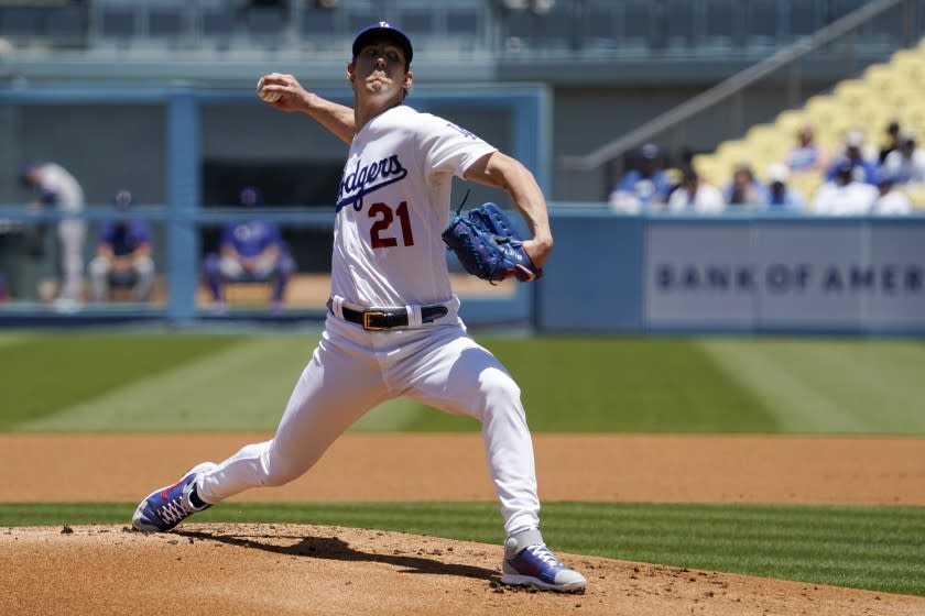 Los Angeles Dodgers starting pitcher Walker Buehler throws to the plate during the first inning.