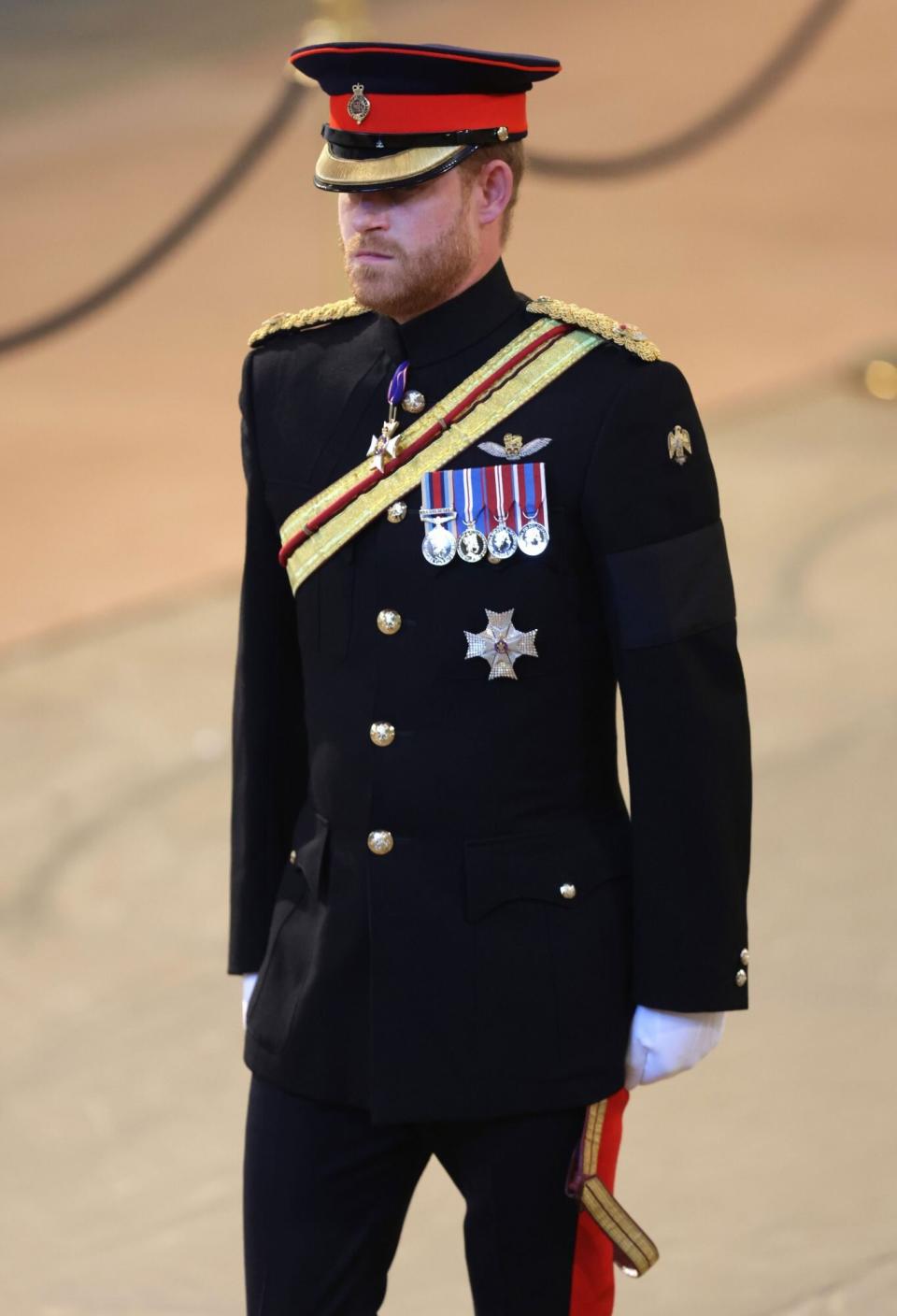 LONDON, ENGLAND - SEPTEMBER 17: Prince Harry, Duke of Sussex arrives to hold a vigil in honour of Queen Elizabeth II at Westminster Hall on September 17, 2022 in London, England. Queen Elizabeth II's grandchildren mount a family vigil over her coffin lying in state in Westminster Hall. Queen Elizabeth II died at Balmoral Castle in Scotland on September 8, 2022, and is succeeded by her eldest son, King Charles III. (Photo by Chris Jackson/Getty Images)