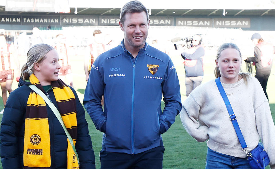 Sam Mitchell, pictured here with daughters Emmerson and Scarlett.