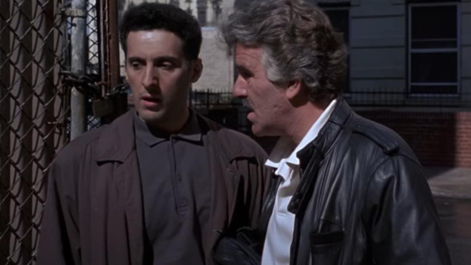 John Turturro talking to another man in Men of Respect.