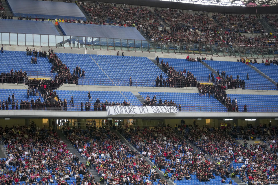 AC Milan fans leave their seats during a Serie A soccer match between AC Milan and Genoa, at the San Siro stadium in Milan, Italy, Sunday, May 5, 2024. (AP Photo/Luca Bruno)