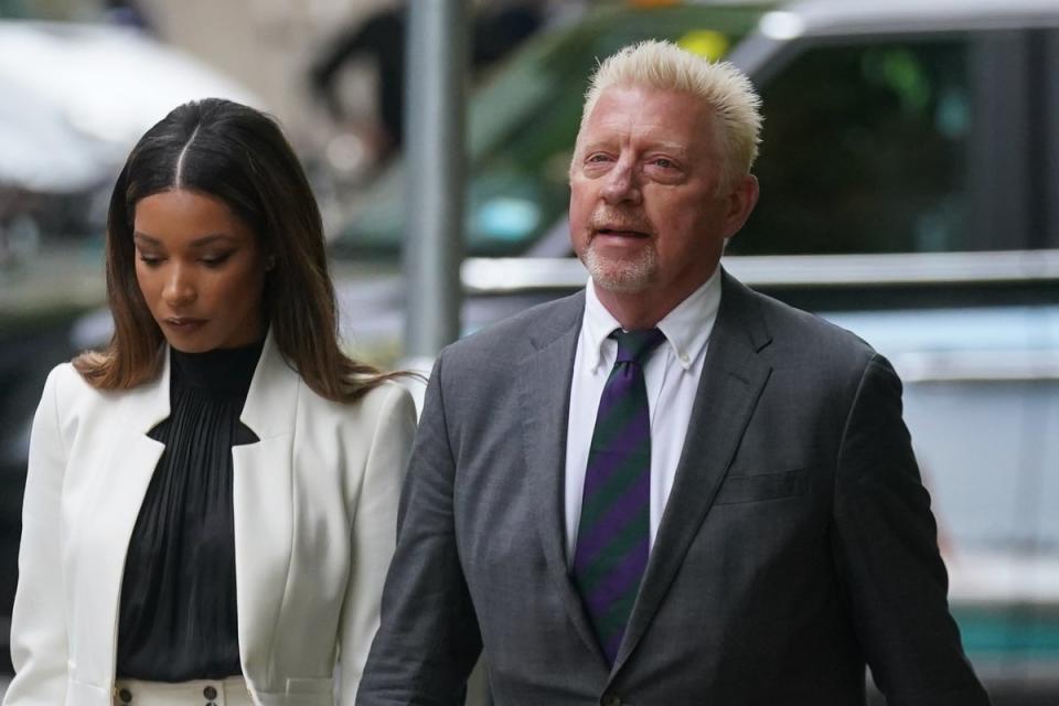 Becker with his girlfriend Lillian de Carvalho (PA)