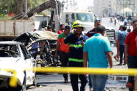 A wreckage of a car is seen at the site of car bomb attack near a government office in Karkh district in Baghdad, Iraq May 30, 2017. REUTERS/Khalid al-Mousily