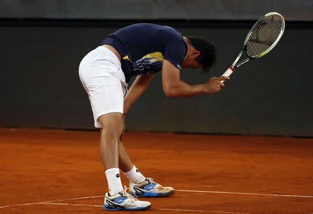 Nicolas Almagro of Spain reacts after losing a point to Andy Murray of Britain during their match at the Madrid Open tennis tournament May 7, 2014. REUTER/Susana Vera