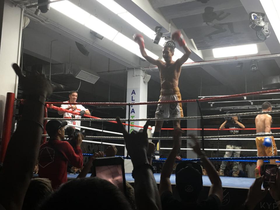 Singapore boxer Hamzah Farouk acknowledges the crowd after defending his WBC Asia Continental title at The Ring Fighting Championship. (PHOTO: Chia Han Keong/Yahoo News Singapore)