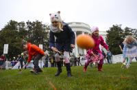 <p>Julia Stimson, 8, from Alexandria, Va., and other children participate in the annual White House Easter Egg Roll on the South Lawn of the White House in Washington, Monday, April 2, 2018. (Photo: Pablo Martinez Monsivais) </p>