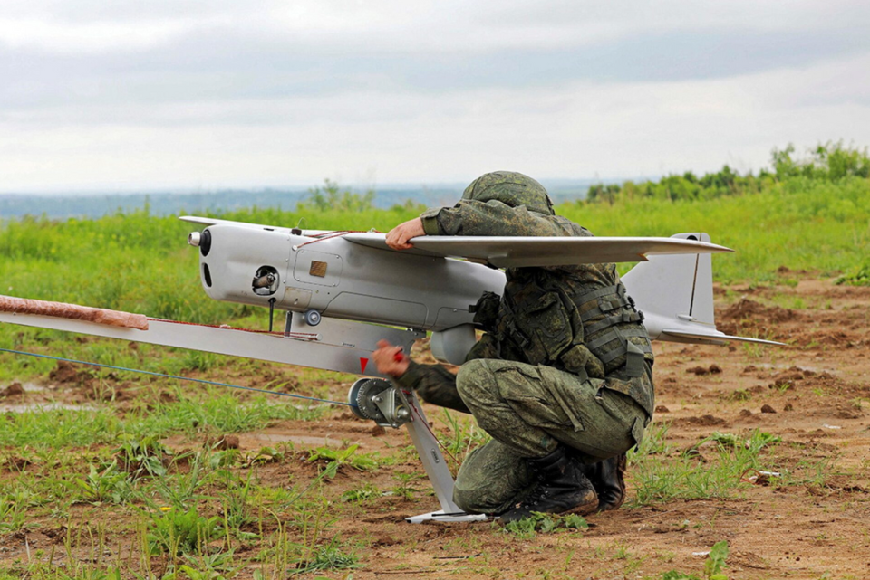 An undated photo of a Russian soldier holding an Orlan-10 drone. (Russian Defense Ministry)