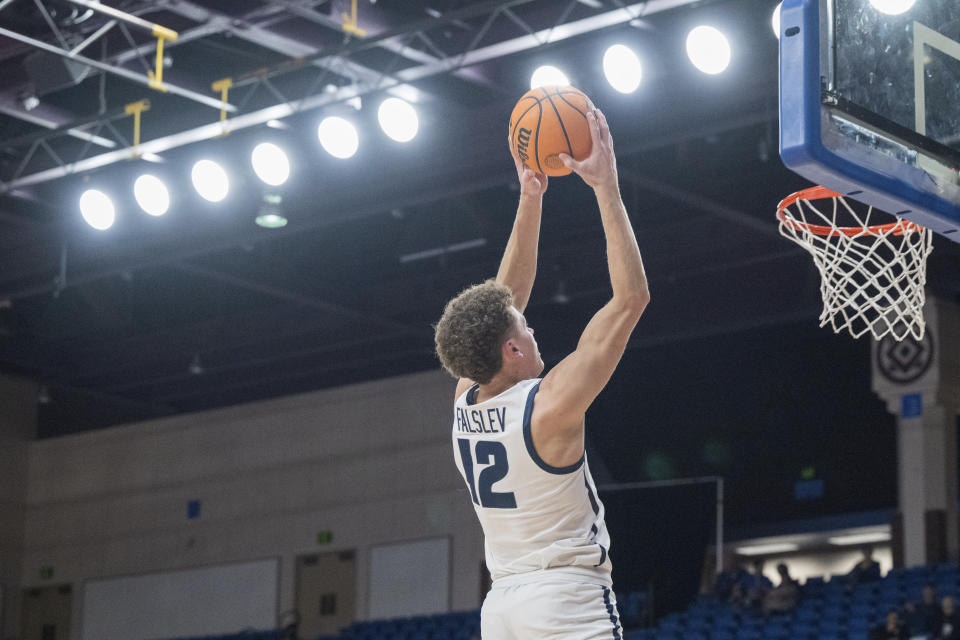Utah State guard Mason Falslev (12) scores a basket during the first half of an NCAA basketball game against San Jose State Wednesday, March 6, 2024, in San Jose, Calif. (AP Photo/Nic Coury)