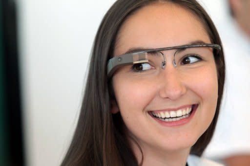 A Google employee wears a pair of "Glass" during Google's Developers Conference on June 27. Google glasses that overlay the Internet on daily lives should hit the market within two years -- technology the tech giant hopes will someday make fumbling with smartphones obsolete