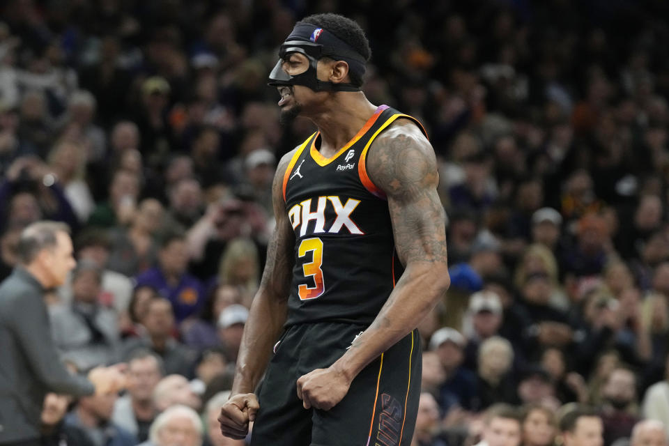 Phoenix Suns guard Bradley Beal celebrates his score against the Milwaukee Bucks during the second half of an NBA basketball game Tuesday, Feb. 6, 2024, in Phoenix. The Suns won 114-106. (AP Photo/Ross D. Franklin)