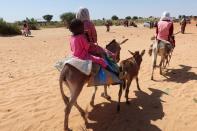 Children cross the border on their donkeys from Sudan to Chad, in Chad