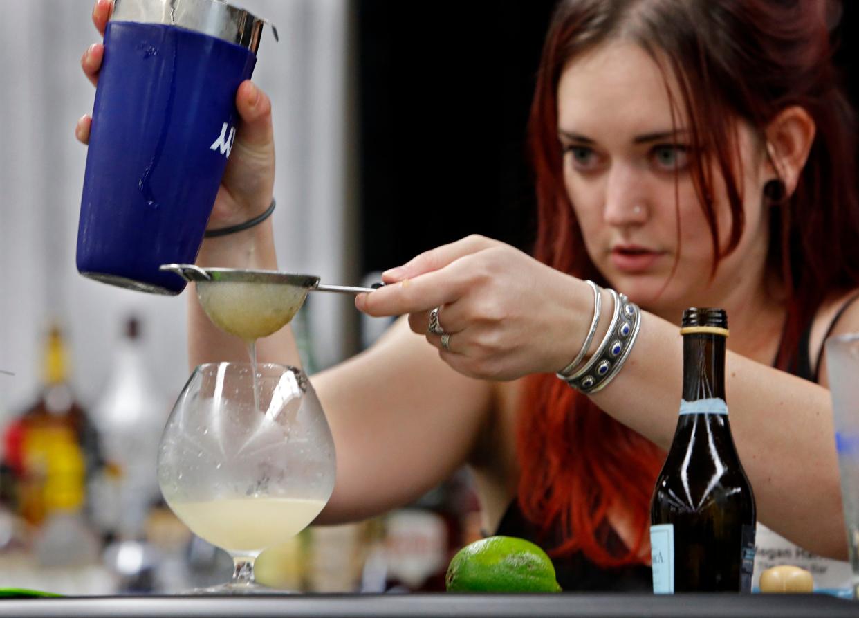 Megan Harris mixes a drink during the Cocktail Shakedown Contest at the Oklahoma Restaurant Association Convention and Expo in this 2015 file photo.
