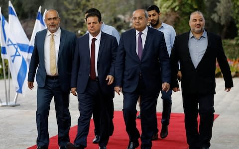 The leaders of the Joint List at the president's office - Credit: Menahem Kahana/Pool via AP