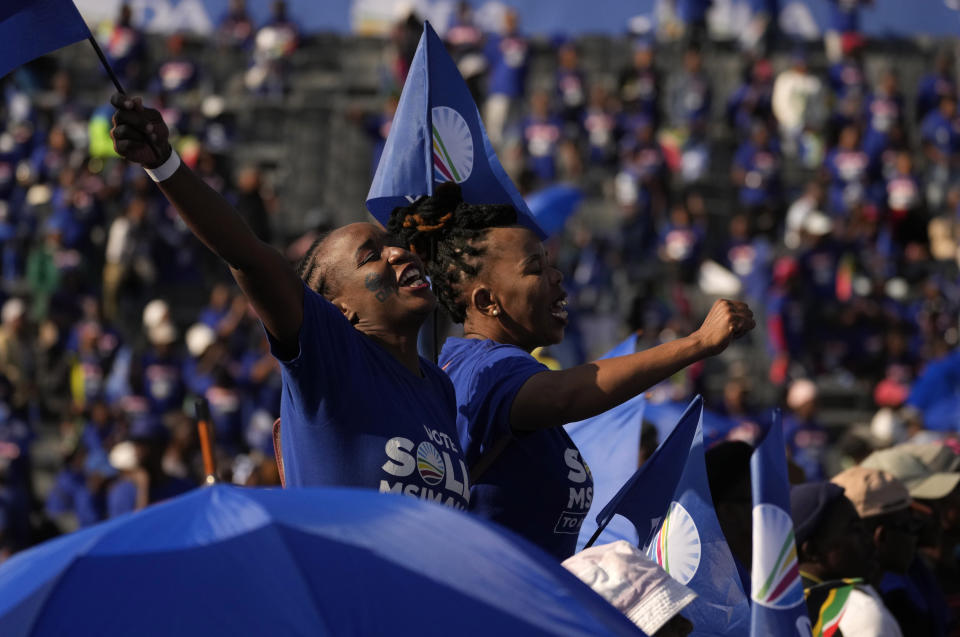 Supporters of the main opposition Democratic Alliance (DA) party attend a final election rally in Benoni, South Africa, Sunday, May 26, 2024. South Africa's four main political parties began the final weekend of campaigning Saturday before a possibly pivotal election that could bring the country's most important change in three decades. (AP Photo/Themba Hadebe)