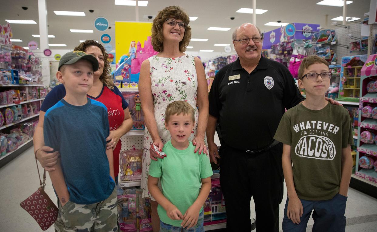 Lee Ann Kwiatkowski, Muncie Community Schools CEO and director of education, stands with a local family she was helping do some back-to school shopping in 2020 as part of the  Back-to-School Heroes and Helpers program. "Dr. K" is retiring as CEO at the end of the school year.