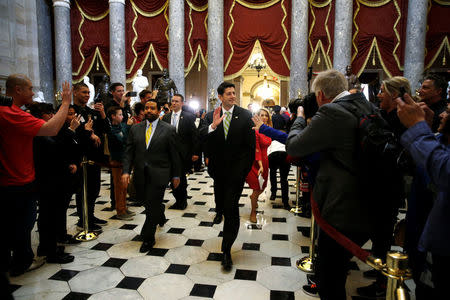 U.S. House Speaker Paul Ryan (R-WI) (C) waves to tourists after the House voted on a procedural measure to move ahead with health care legislation to repeal Obamacare at the U.S. Capitol in Washington, U.S., March 24, 2017. REUTERS/Jonathan Ernst