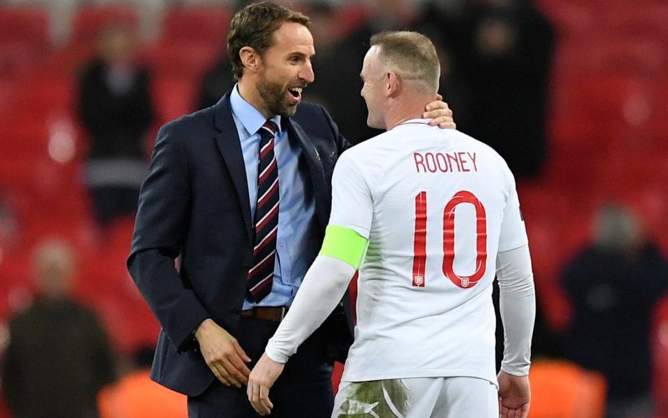 Wayne Rooney bids farewell to his England career with Gareth Southgate after his valedictory appearance against the United States - REUTERS