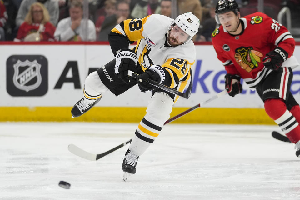 Pittsburgh Penguins defenseman Marcus Pettersson passes the puck during the second period of the team's NHL hockey game against the Chicago Blackhawks, Thursday, Feb. 15, 2024, in Chicago. (AP Photo/Erin Hooley)