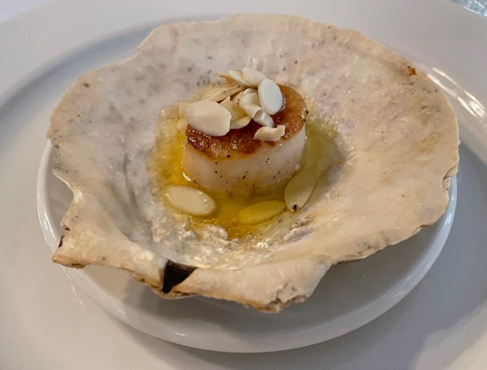 Dinner guests at Glenlaurel can look forward to courses such as this sel de mer Atlantic diver scallop on shell bed with toasted almond beurre noisette appetizer.