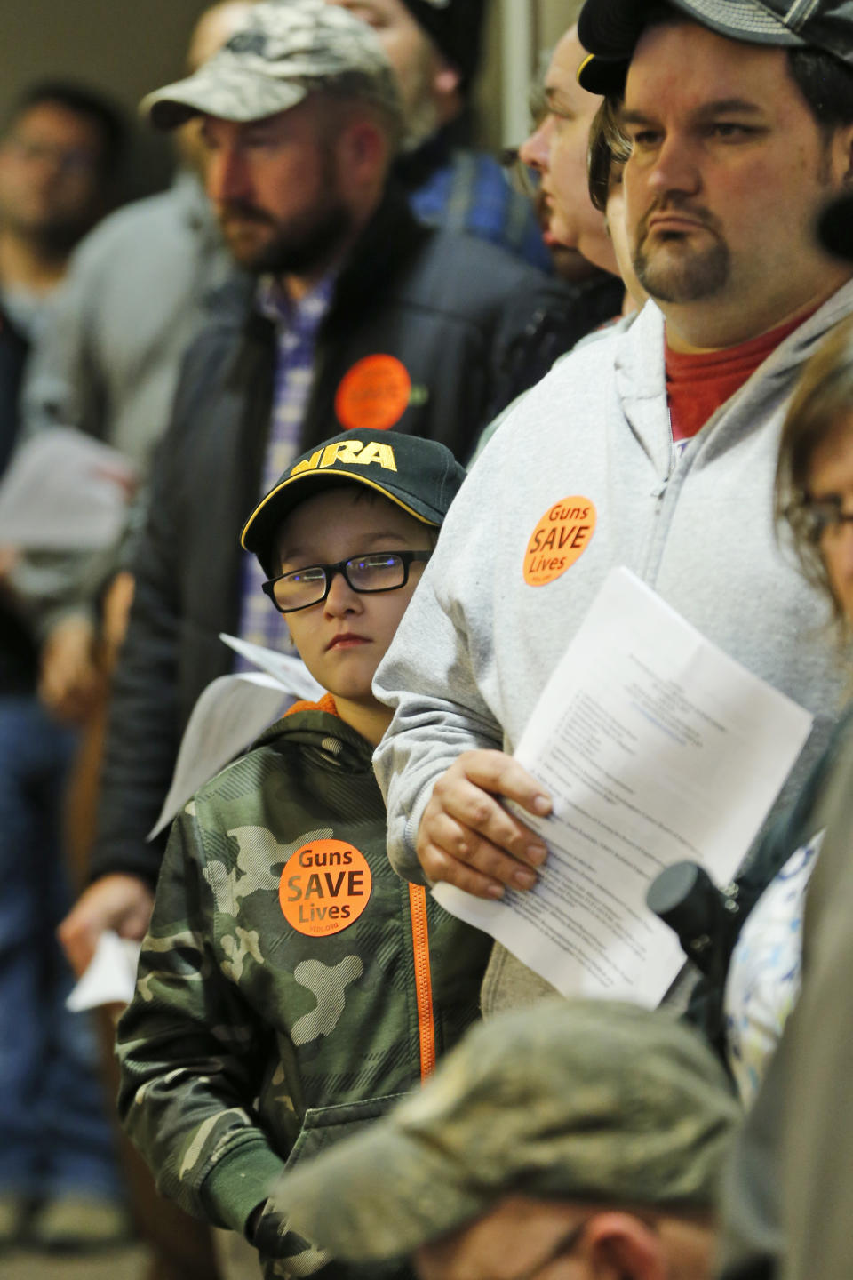 Second amendment supporters watch as the Buckingham County Board of Supervisors unanimously voted to pass a Second Amendment Sanctuary City resolution at a meeting in Buckingham , Va., Monday, Dec. 9, 2019. More than two dozen counties in Virginia have voted to declare themselves “Second Amendment Sanctuaries” and are vowing to resist any attempts to tighten restrictions on guns. (AP Photo/Steve Helber)