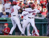 Washington Nationals' Josh Bell (19) celebrates a two-run home run with Juan Soto (22) during the seventh inning of a baseball game against the Pittsburgh Pirates, Wednesday, June 16, 2021, in Washington. Washington won 3-1. (AP Photo/Carolyn Kaster)