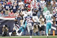 <p>New England Patriots free safety Duron Harmon (30) intercepts a pass intended for Miami Dolphins wide receiver DeVante Parker (11) during the fourth quarter at Gillette Stadium. The New England Patriots won 31-24. Mandatory Credit: Greg M. Cooper-USA TODAY Sports </p>