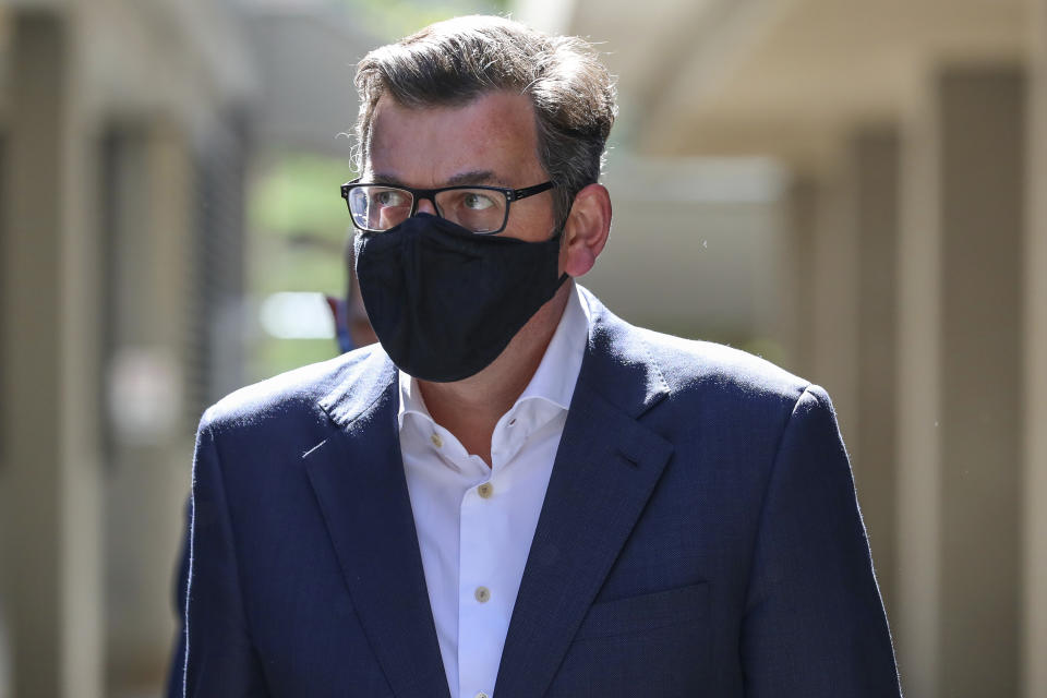 Premier of Victoria state, Daniel Andrews arrives for his daily press conference in Melbourne, Australia, Wednesday, Oct. 28, 2020. Australia’s second largest city of Melbourne which was a coronavirus hotspot emerges from a nearly four-months lockdown, with restaurants, cafes and bars opening and outdoor contact sports resuming on Wednesday. (AP Photo/Asanka Brendon Ratnayake)