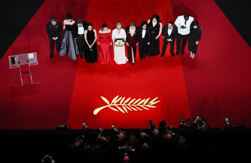 Member of the Jury of the 77th Cannes Film Festival Japanese director Hirokazu Kore-eda, French actress and model Eva Green, Italian actor Pierfrancesco Favino, French actress and master of the ceremony of the 77th cannes film festival Camille Cottin, French actress Juliette Binoche, US actress Meryl Streep, US director and president of the Jury of the 77th Cannes Film Festival Greta Gerwig, members of the Jury of the 77th Cannes Film Festival Lebanese director Nadine Labak, US actress Lily Gladstone, Spanish director, producer, and writer Juan Antonio Bayona, French actor and comedian Omar Sy and Turkish actress and screenwriter Ebru Ceylan pose on stage after US actress Meryl Streep received the Honorary Palme d'Or.