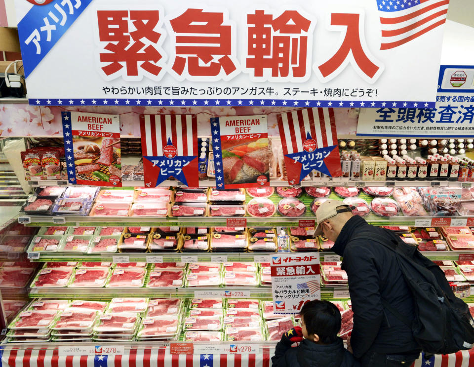 In this Feb. 16, 2019, photo, packs of frozen beef imported from the U.S. are sold at a supermarket in Tokyo. The U.S. Department of Agriculture estimates exports of U.S. beef and beef product could jump by up to $200 million a year, though they do face stiff competition from Australia and China. Japan still imposes limits on many farm products, seeking to guard its food security and politically important rural constituencies, and Perdue acknowledged that a broader trade deal with Tokyo may take time. The banner in the background reads: "Emergency import." (Kyodo News via AP)