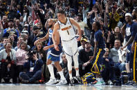 Denver Nuggets forward Michael Porter Jr. reacts after hitting a 3-point basket against the Minnesota Timberwolves in the first half of an NBA basketball game Tuesday, Feb. 7, 2023, in Denver. (AP Photo/David Zalubowski)