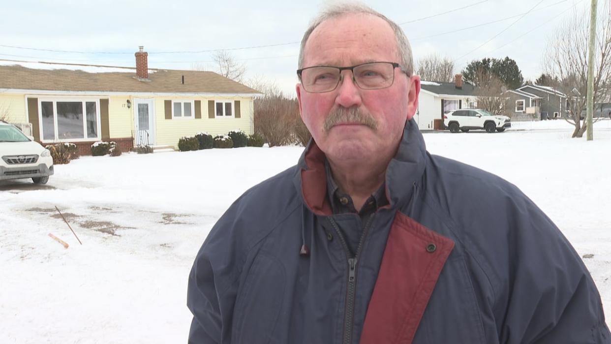 George Crawford has gathered more than 100 names on a petition opposing the Hidden Valley development. (Laura Meader/CBC - image credit)