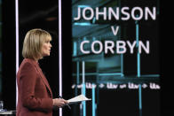 In this photo issued by ITV, newscaster and debate adjudicator Julie Etchingham during a live TV debate between main opposition Labour Party leader Jeremy Corbyn and Prime Minister Boris Johnson, during an election head-to-head debate live on TV, in Manchester, England, Tuesday, Nov. 19, 2019. Boris Johnson and Jeremy Corbyn are set to go head-to-head in their first live televised debate Tuesday evening, as the UK prepares for a General Election on Dec. 12. (ITV via AP)