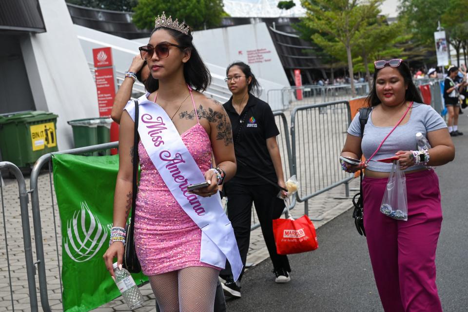 Fans of US singer Taylor Swift, also known as a Swifties, arrive for the first of the pop star's six sold-out Eras Tour concerts at the National Stadium in Singapore on March 2, 2024.