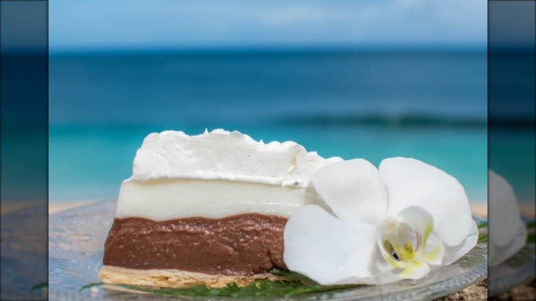 Chocolate haupia pie outside with flower