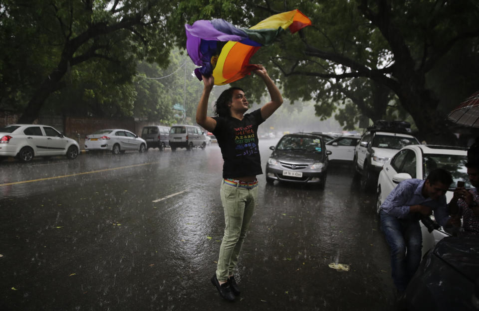 FILE - A gay rights activist celebrates after the country's top court struck down a colonial-era law that made homosexual acts punishable by up to 10 years in prison, in New Delhi, India Sept. 6, 2018, a landmark victory for gay rights that one judge said would “pave the way for a better future.” (AP Photo/Altaf Qadri, File)