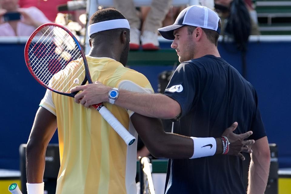 Frances Tiafoe, left, and Tommy Paul, right, meet at the net after their semifinal match at the Delray Beach Open tennis tournament, Saturday, Feb. 17, 2024, in Delray Beach, Fla. (AP Photo/Lynne Sladky)