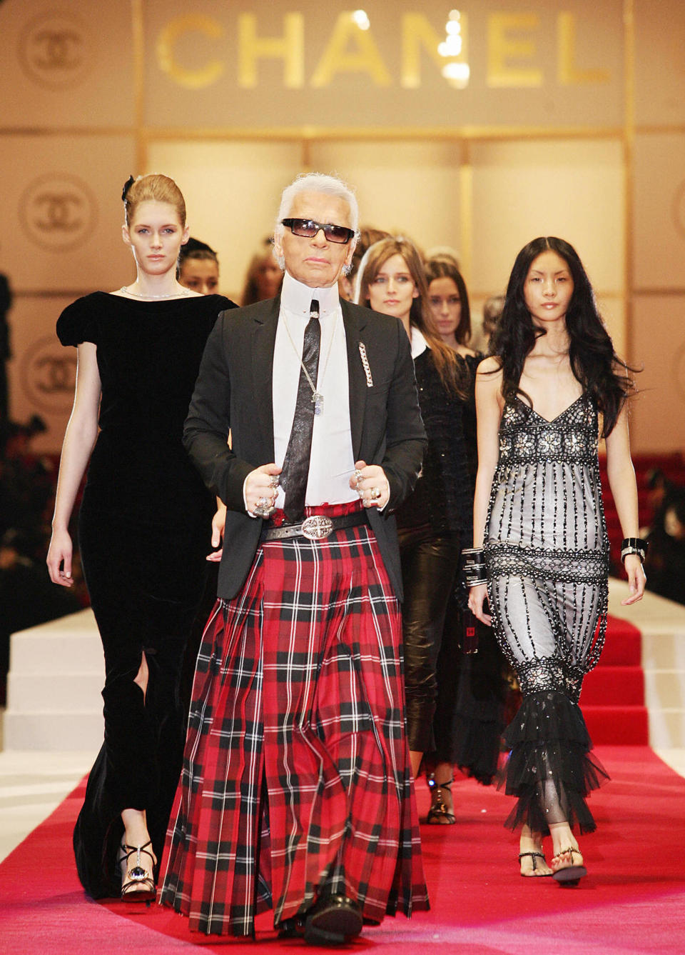 <p>Karl Lagerfeld eschewed his traditional suit in favour of a kilt at the SS15 show in Tokyo. <em>[Photo: Getty]</em> </p>