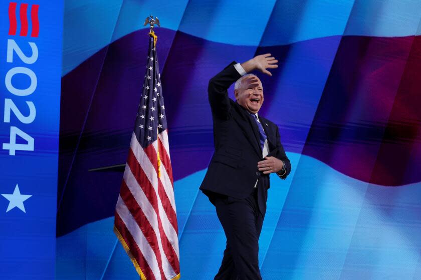 DNC CHICAGO, IL AUGUST 21, 2024 - Democratic vice presidential nominee Minnesota Gov. Tim Walz on stage during the Democratic National Convention Wednesday, Aug. 21, 2024, in Chicago. (Robert Gauthier/Los Angeles Times)