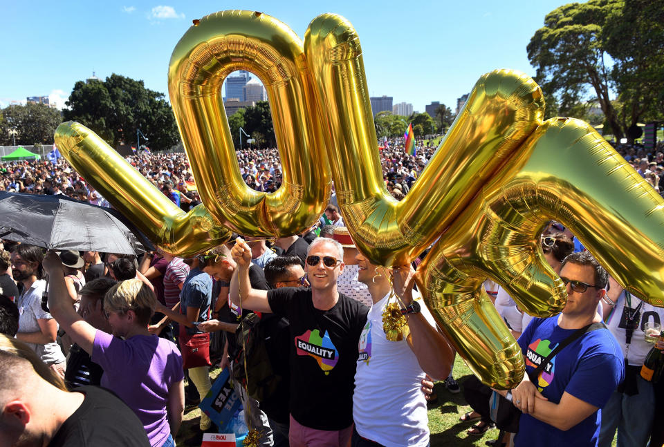 <p>Supporters of the same-sex marriage ‘Yes’ vote gather to celebrate the announcement in a Sydney park on Nov. 15, 2017. (Photo: William West/AFP/Getty Images) </p>