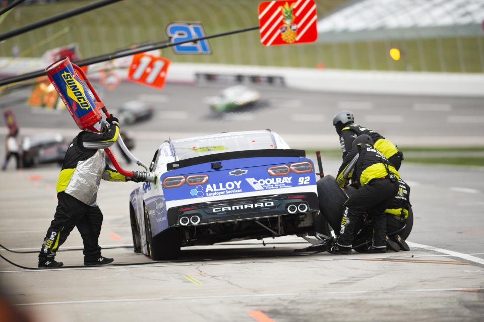 Josh Williams makes a pit stop during the NASCAR Xfinity Series auto race at Atlanta Motor Speedway on Saturday, March 18, 2023, in Hampton, Ga. (AP Photo/Hakim Wright Sr.)