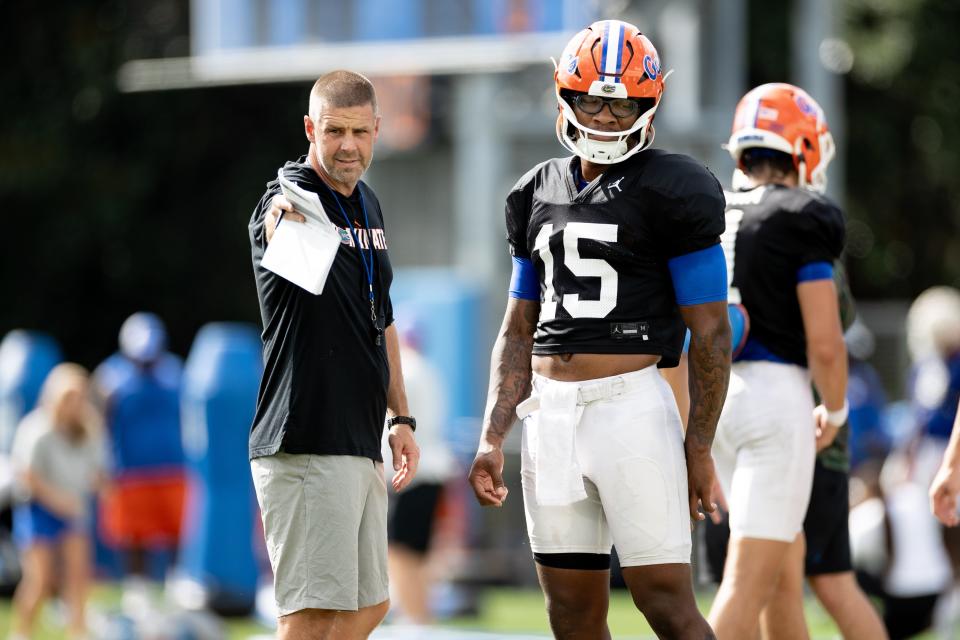 Florida Gators head coach Billy Napier instructs Florida Gators quarterback Anthony Richardson (15) during fall football practice at Sanders Outdoor Practice Fields in Gainesville, FL on Tuesday, August 23, 2022. [Matt Pendleton/Gainesville Sun]