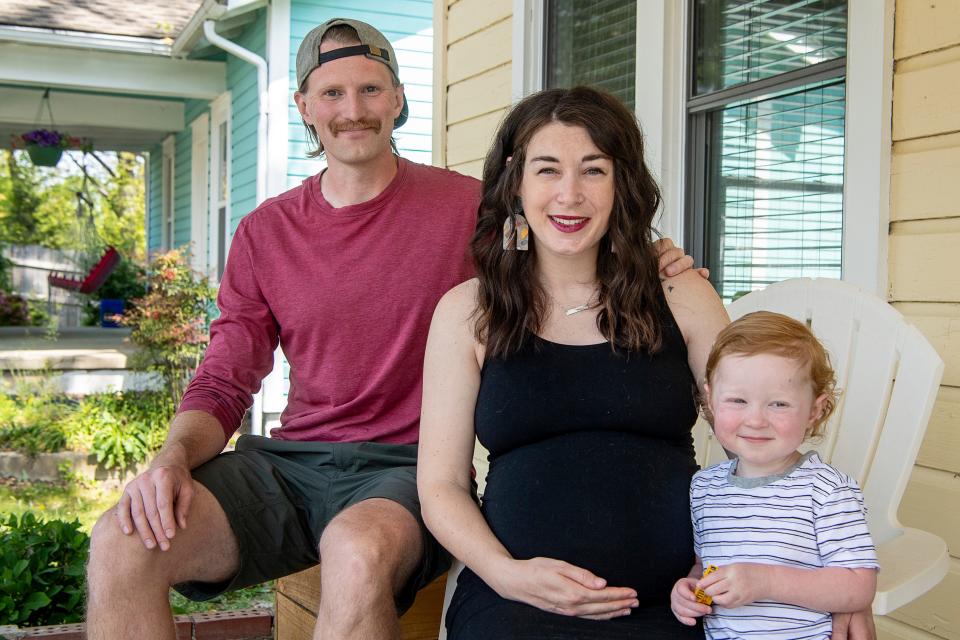 Devin with her husband, Adam, and son, Hollis, at their home in greater Asheville, May 2, 2022.