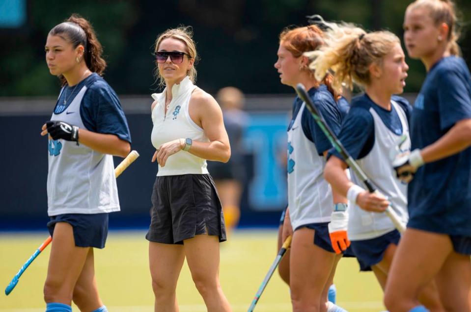 North Carolina field hockey coach Erin Matson watches her team as they warm up for their game against Iowa on Sunday, August 27, 2023 at Karen Shelton Stadium in Chapel Hill, N.C. Robert Willett/rwillett@newsobserver.com