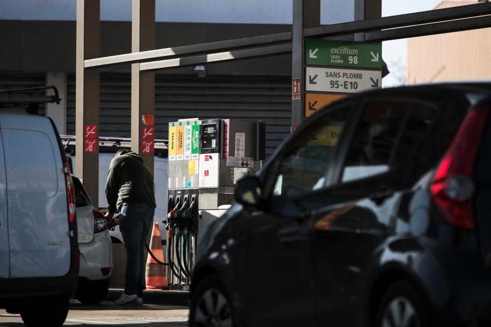 A customer refuels a vehicle at a gas station in Toulouse, France.